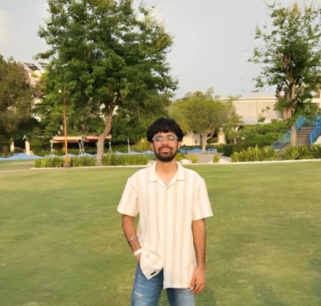 Young man in striped shirt and jeans